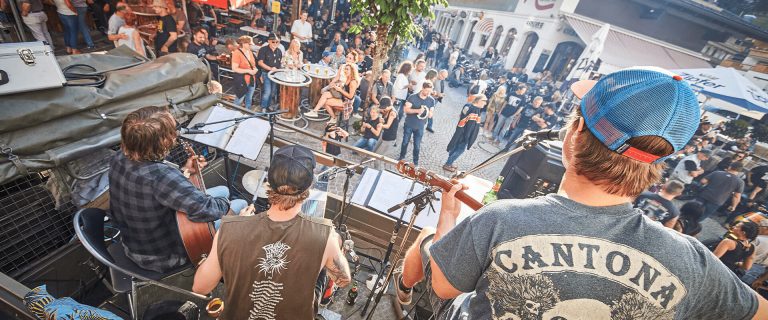 Biker Meeting with Live Music, Numerous Guests Celebrate in a Convivial Atmosphere.